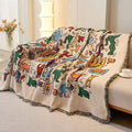 Close-up of thick woven fringe edges on the graffiti-style blanket
