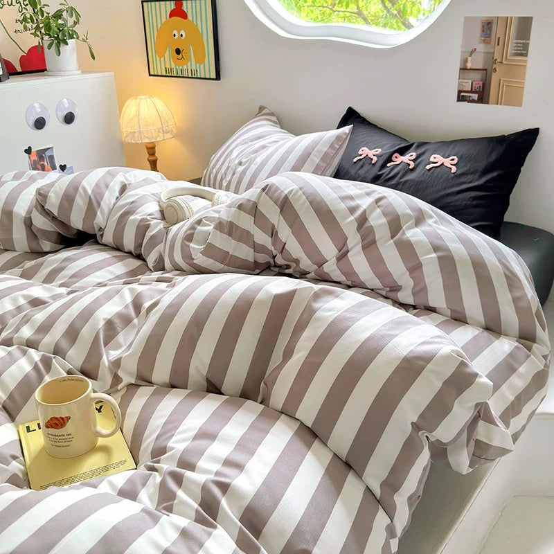 Close-up of cotton comforter showcasing minimalist stripe design