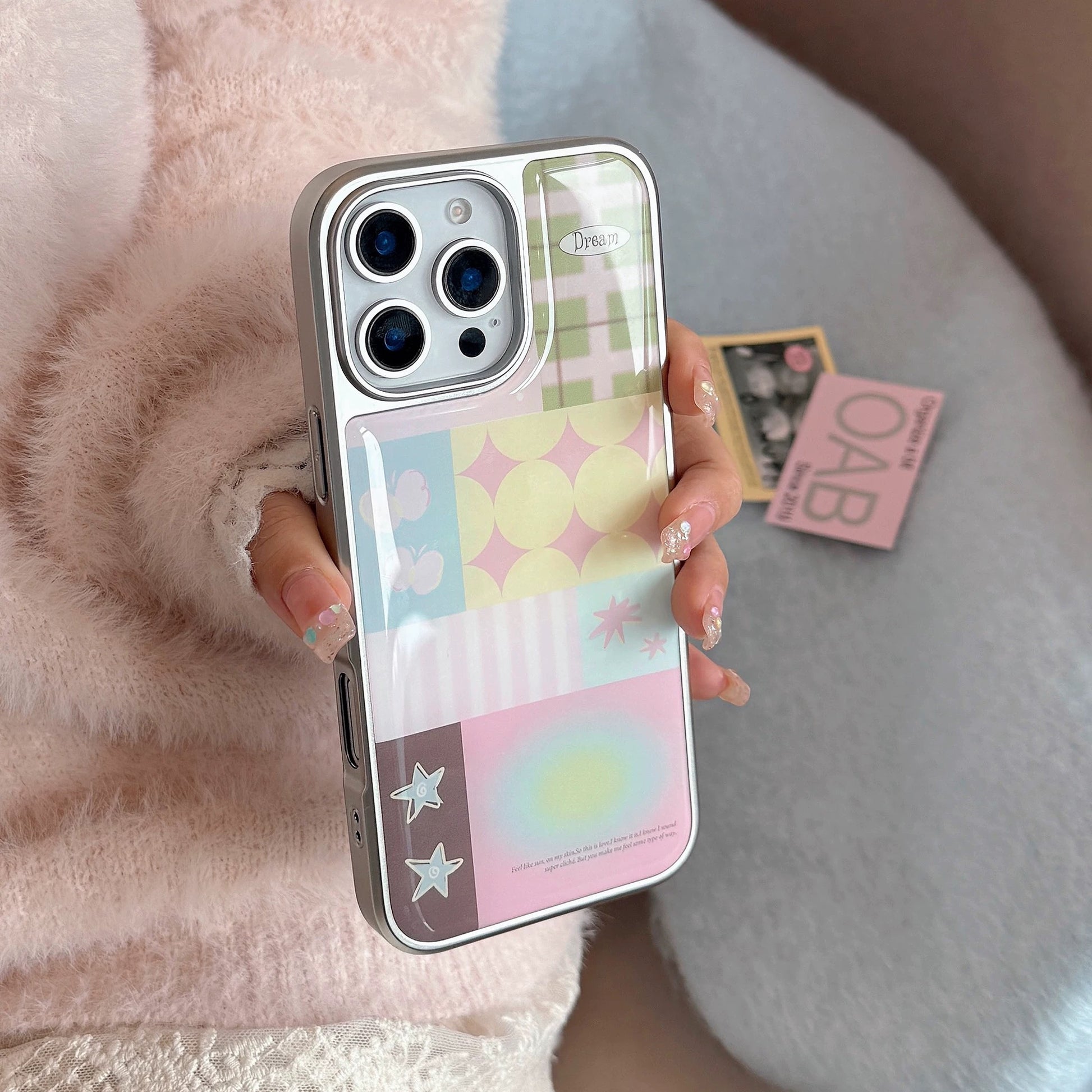 Y2K design iPhone cover with pink, green, and yellow tones in patch layout