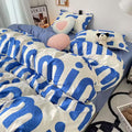 Teen girl’s cozy room with statement bedding