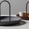 The tray placed on a vanity table, neatly organizing jewelry and cosmetics.
