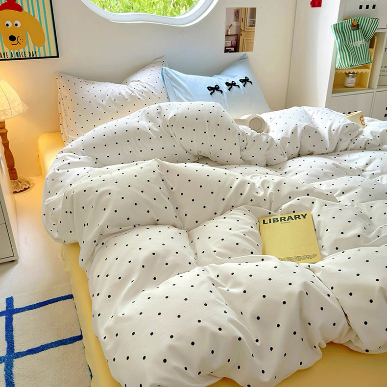Dorm bed styling with soft girl accessories and cozy room lighting