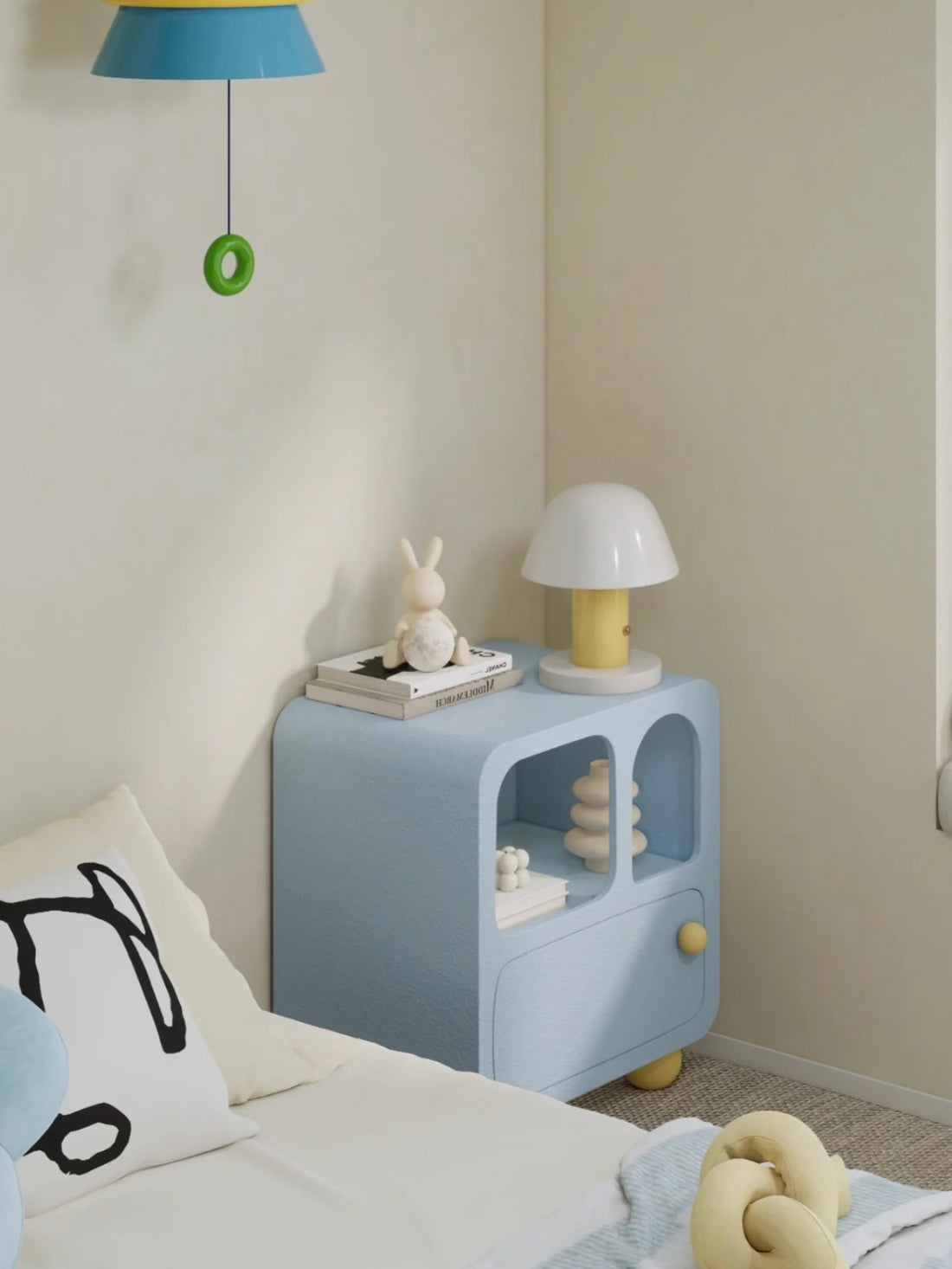 A blue nightstand shown from the front holds a white dome lamp above open cubbies and a closed drawer.