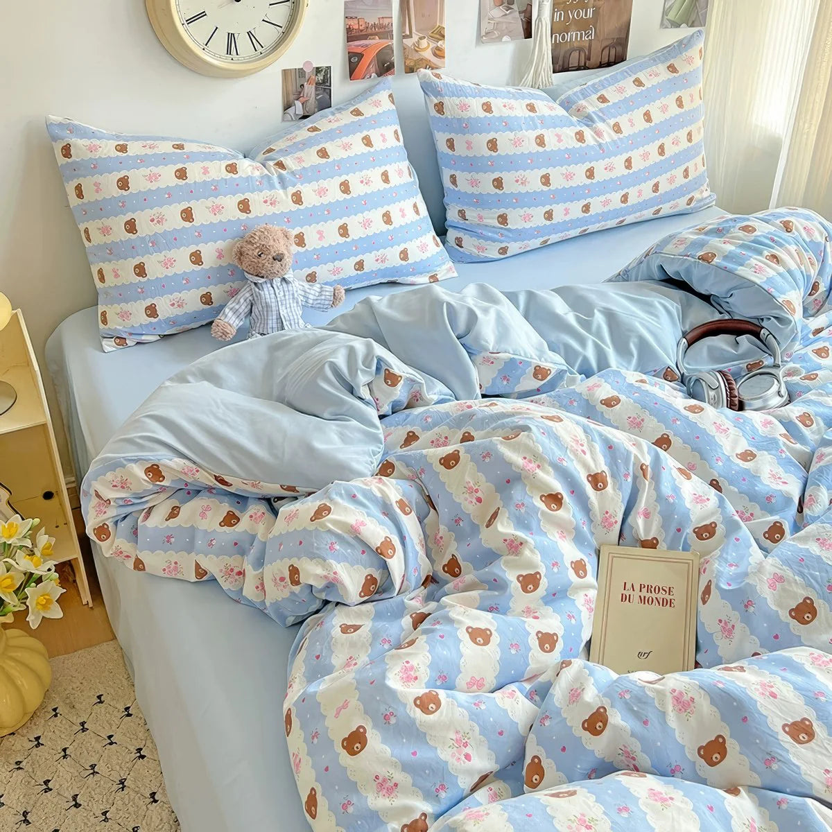 Cute coquette-style bedding set with teddy print in soft pastel blue tones.