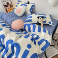Bold blue letter bedding set in cozy Korean-style bedroom