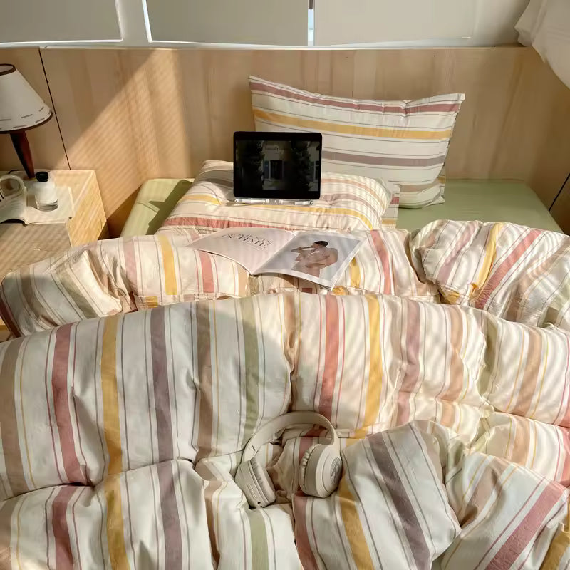Pastel striped cotton duvet cover with breathable fabric displayed on cozy modern bed setup