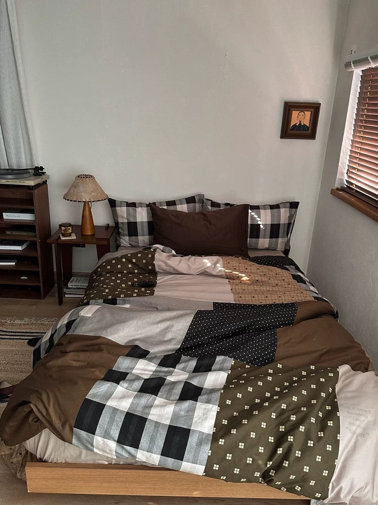 Full view of a brown plaid duvet cover with different check patterns