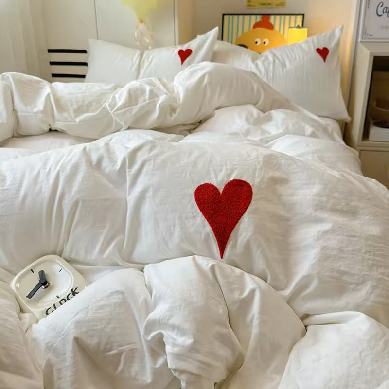 Washed cotton duvet cover set neatly folded, highlighting fabric texture.