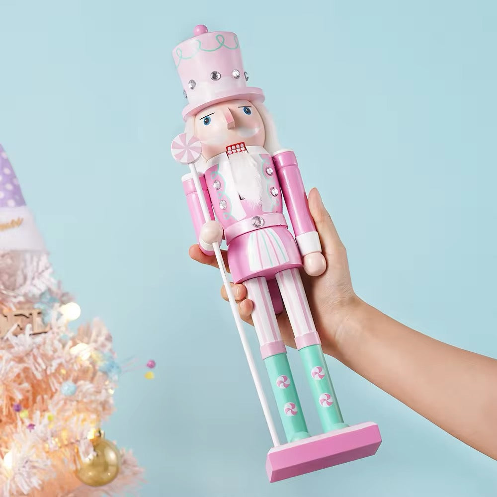 Rustic wooden nutcracker figurine with candy-themed colors. Ideal holiday decoration for home, office, or Christmas tree.