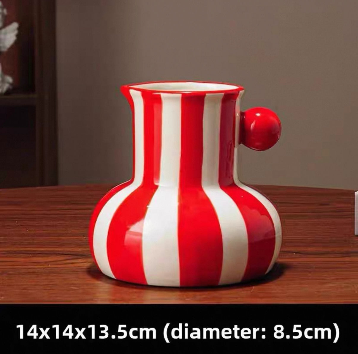 Red and white striped ceramic vase on a wooden surface with dimensions displayed.