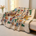 Artistic cotton throw blanket used as a picnic mat on the grass