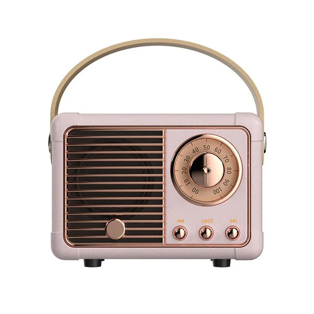 Vintage-style radio with pink body and bronze accents on a white background