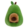 Capybara plush hugging avocado toy in soft aesthetic setting