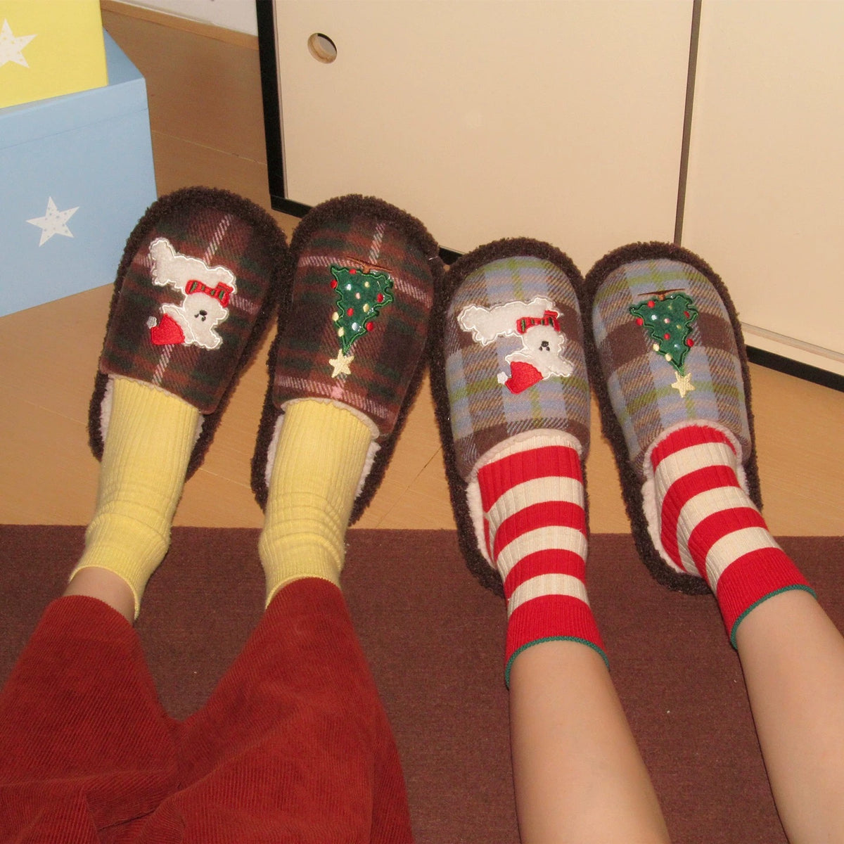 Brown cute Christmas house slippers worn indoors with colorful socks