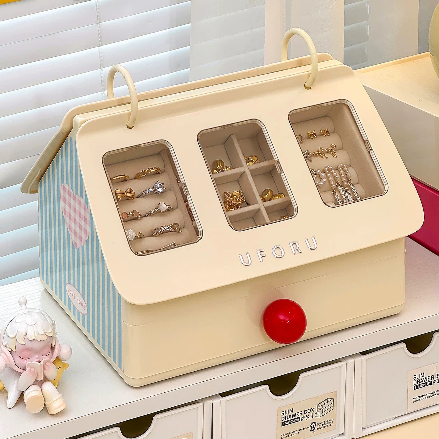 Jewelry organizer with compartments on a white surface