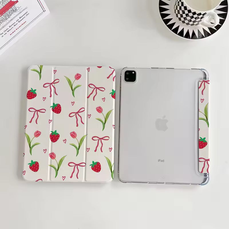 Tablet with floral case on a white surface