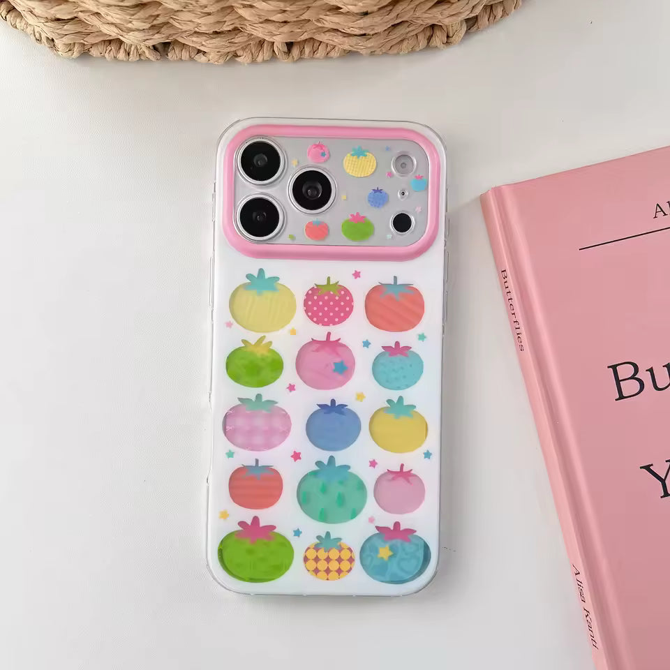 Colorful tomato print silicone iPhone case with pastel fruit illustrations and pink camera frame protection everyday