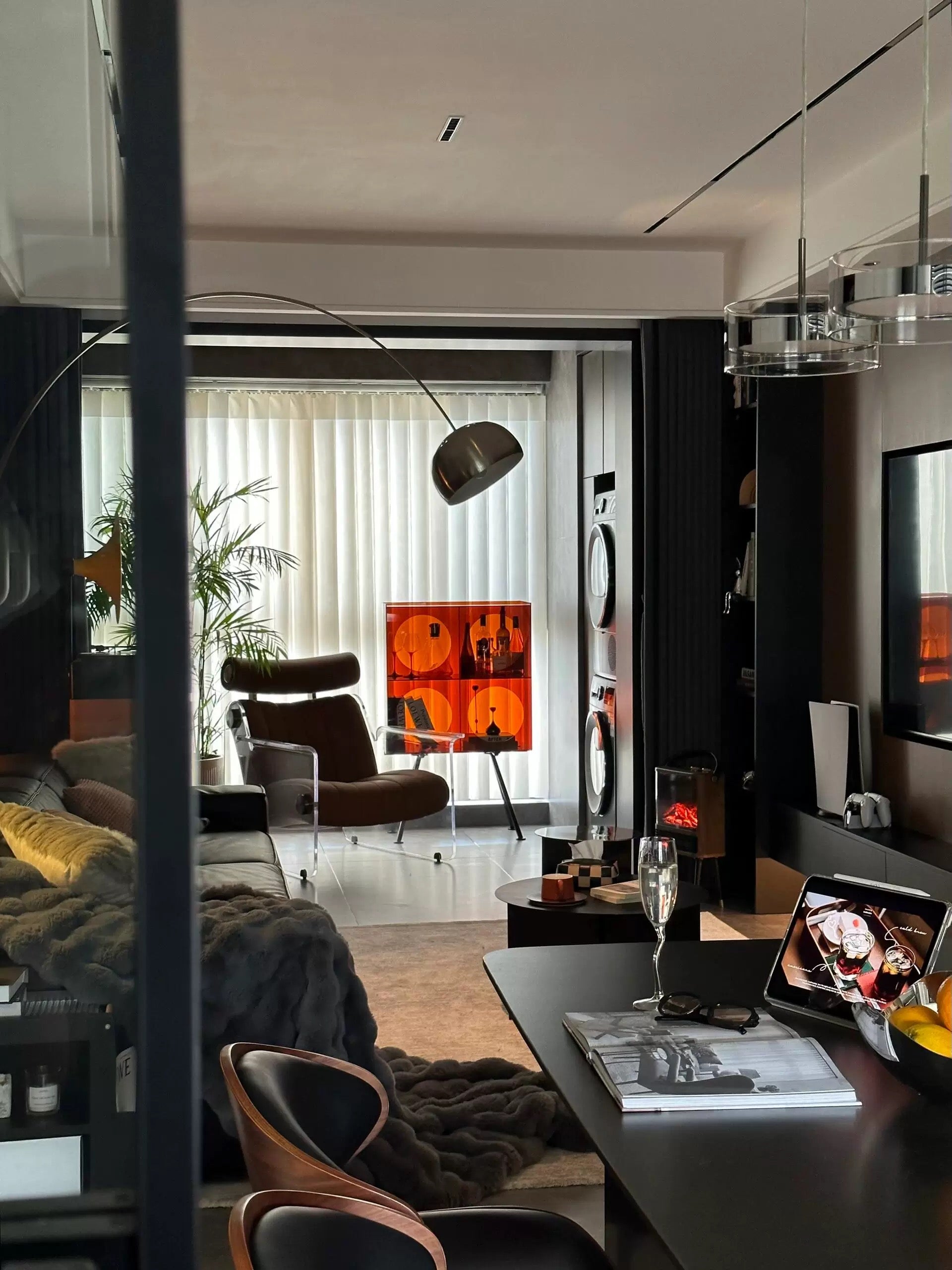 Modern living room with a sofa, coffee table, and decorative items.