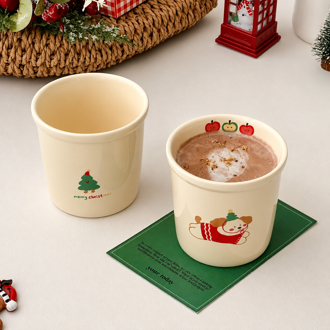 Two cream-colored ceramic Christmas mugs with dachshund and bear illustrations, displayed in a wire basket with kraft gift boxes in the background.