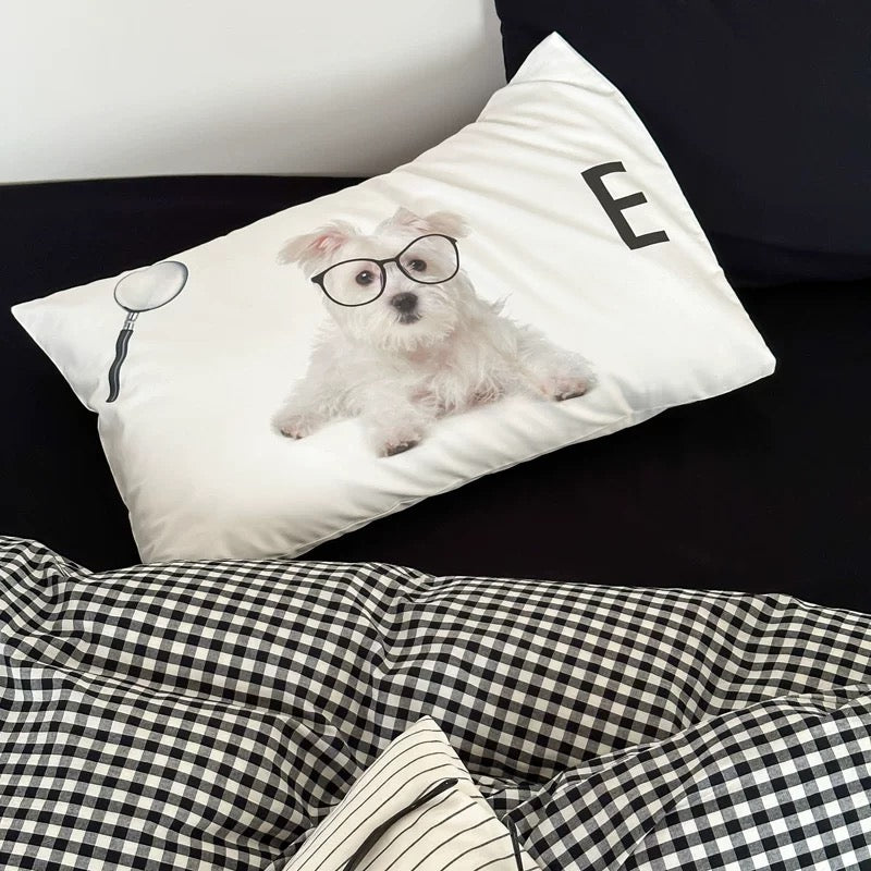 Pillow with a dog wearing glasses design on a black background