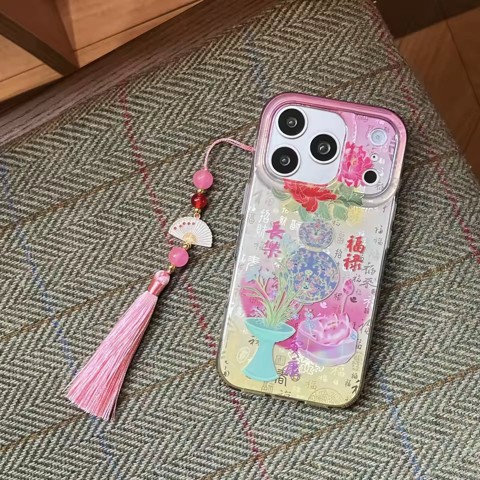 Grandmillennial inspired peony silicone iPhone case with botanical illustration translucent finish and decorative tassel option