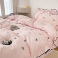 Embroidered bow pillowcases matching the princess bedding vibe