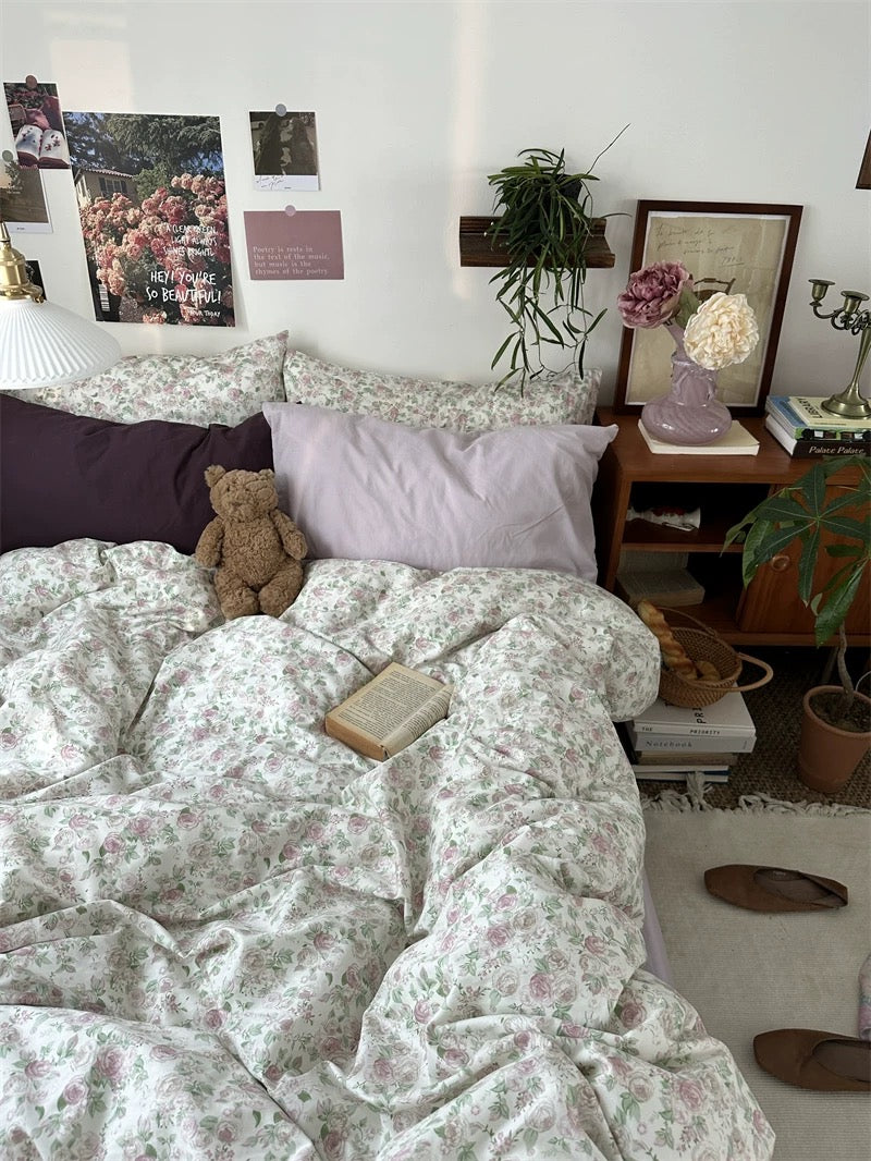 Floral cotton bedding arranged with cozy layered textiles for timeless grandmillennial inspired interior decorating throughout every season.