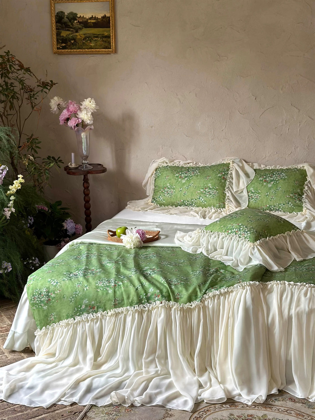 Green and white bedspread on a bed in a room with decorative elements.