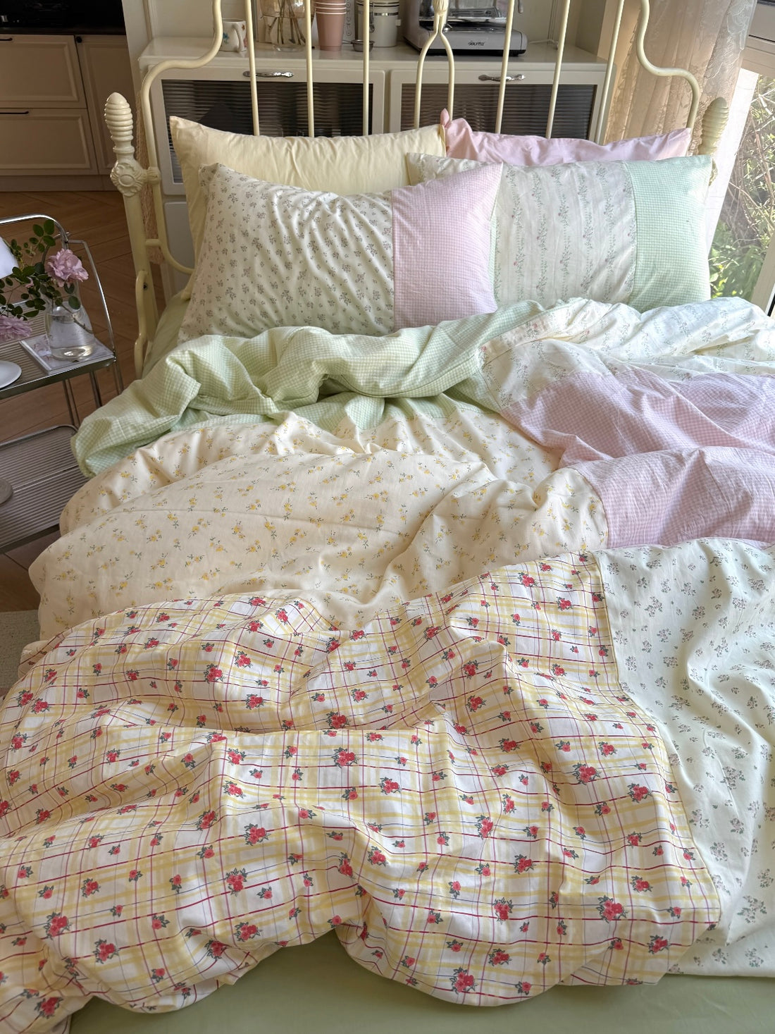 Floral patchwork duvet cover with pastel pink green and cream panels