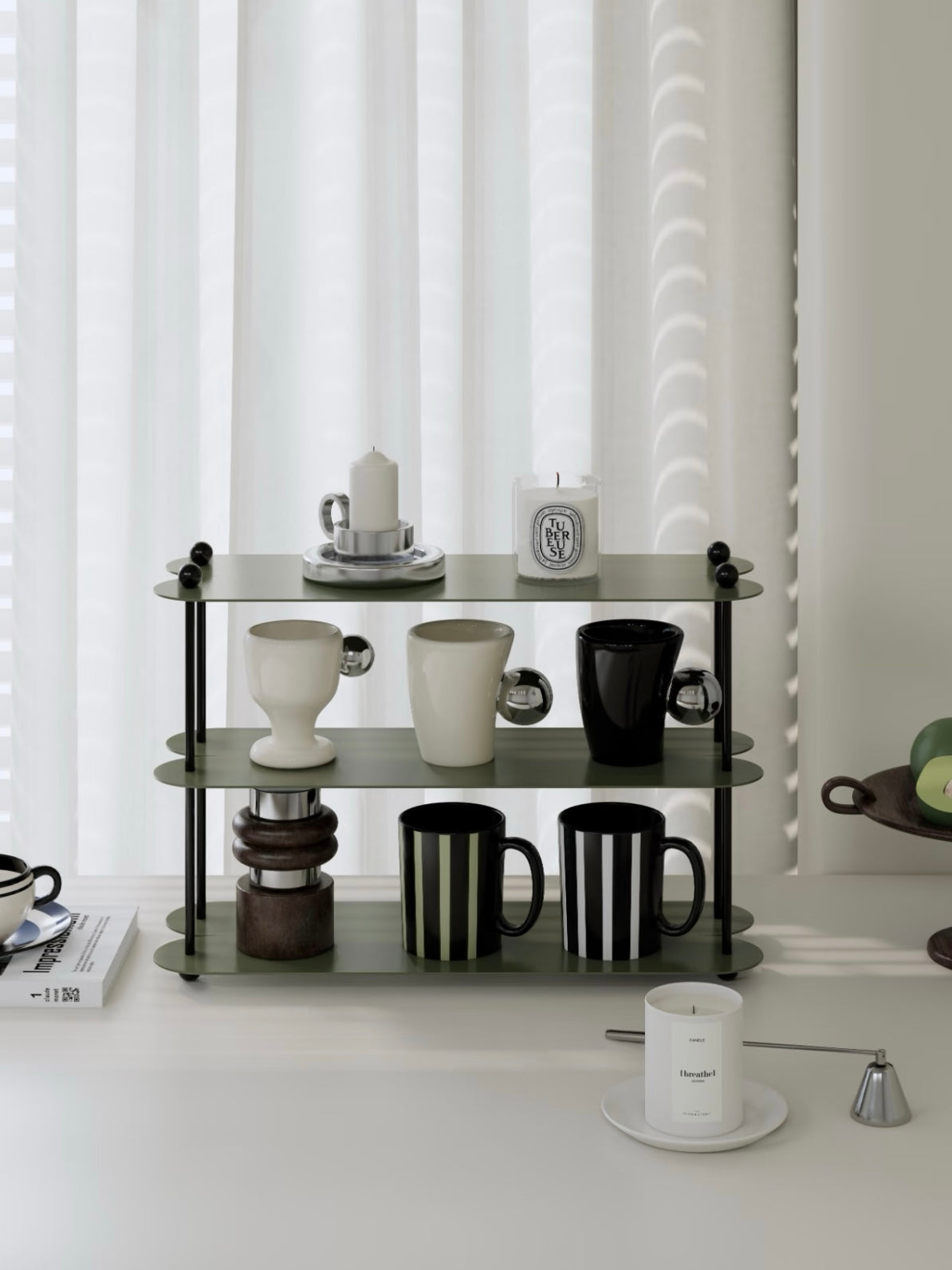 A green tabletop shelf with black posts is shown from the front, with striped mugs along the bottom tier.