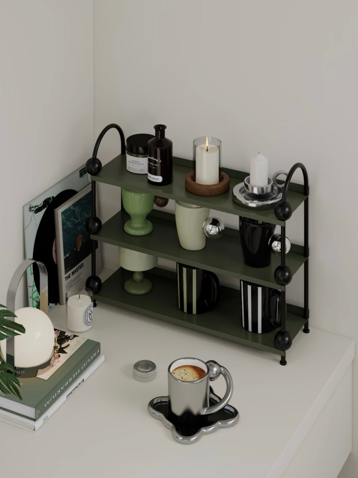 Green vanity shelf shown from the opposite angle with black supports and small bottles on the open tiers.