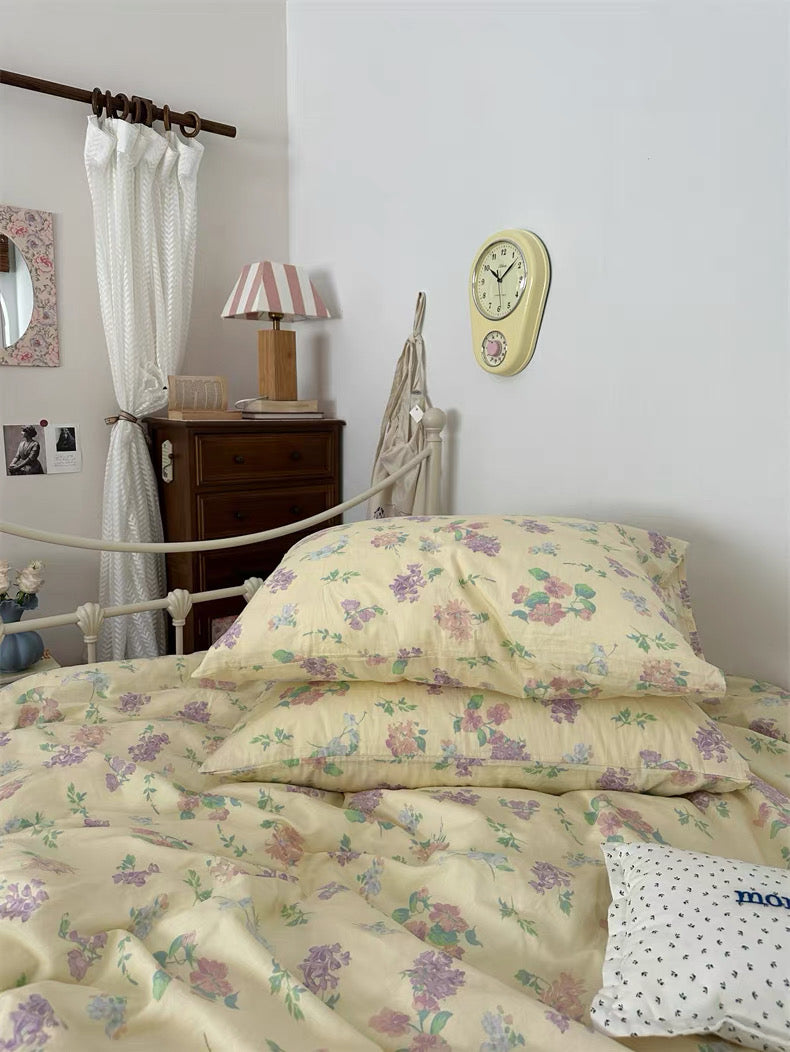 Cottage inspired cotton bedding featuring elegant floral print with matching pillowcases for charming personal sleep spaces