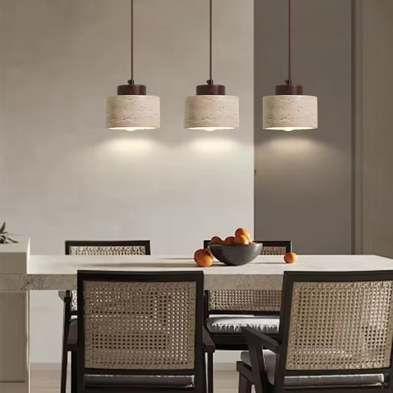 Japandi textured pendant light hanging above bed with warm glow and neutral bedroom decor styling.