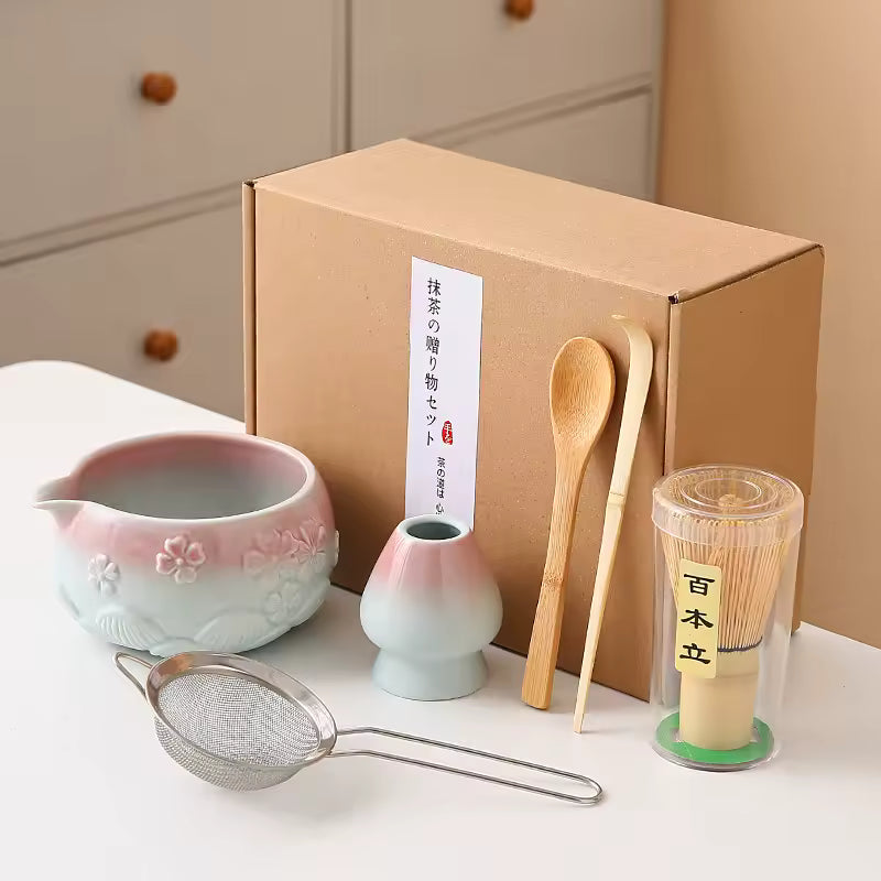 Tea-making set with a cardboard box on a white surface