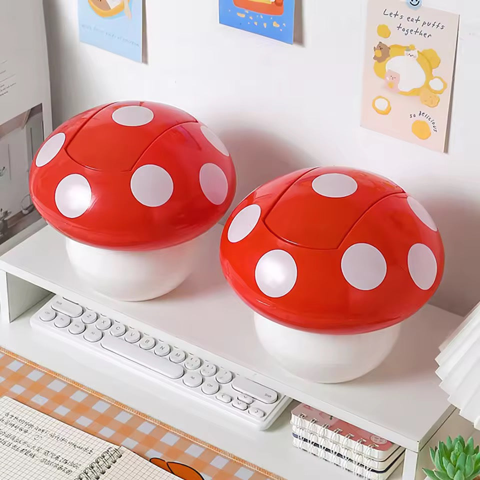 Cute mushroom-shaped trash can on a desk with text 'Desktop Shake Cover Trash Can' and 'Cute'.
