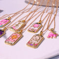 Whimsical pink tarot card charm necklace, perfect for expressing your inner mystic.