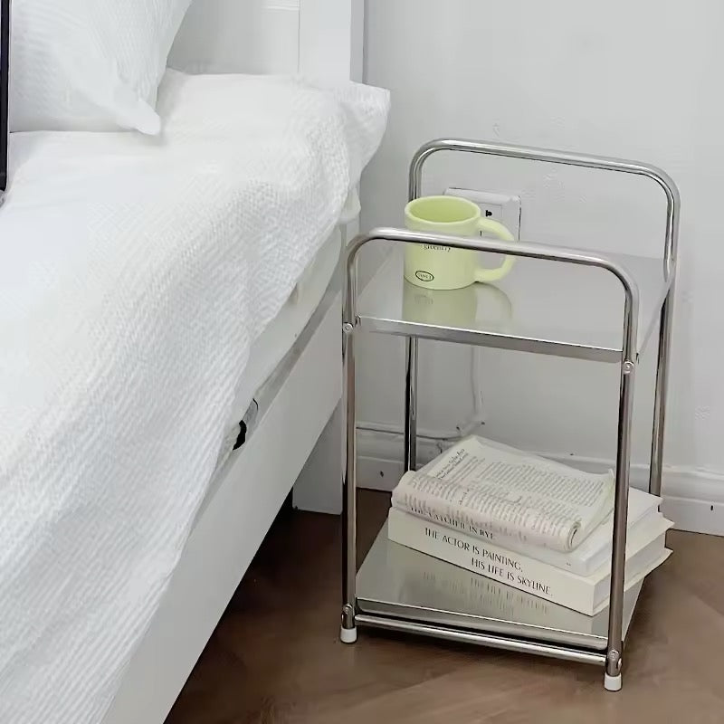 Two-tier stainless steel shelf as bedside table
