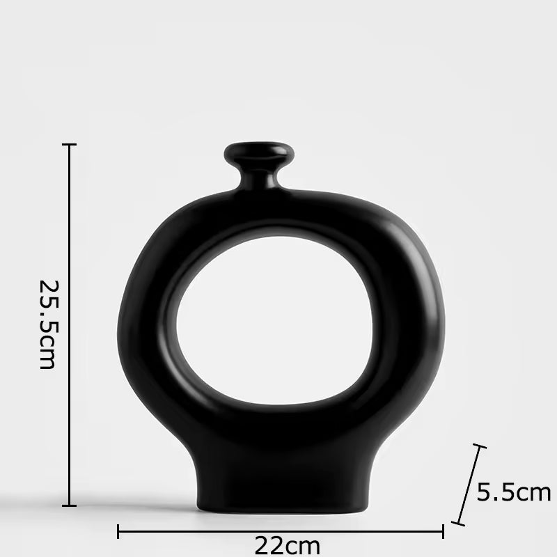 Black vase with measurements on a light gray background