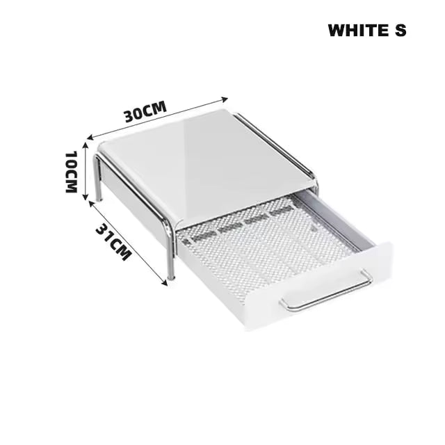Under-machine coffee capsule drawer system that reduces clutter, hides boxes and keeps the kitchen visually calm and organized.