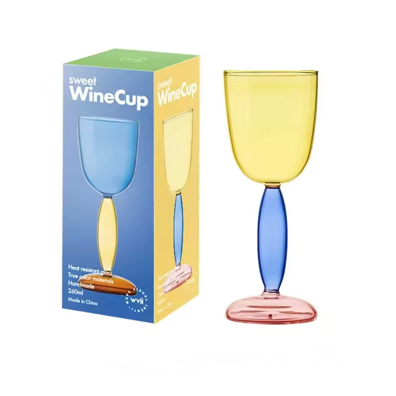 Colorful wine glass with a matching packaging box on a white background
