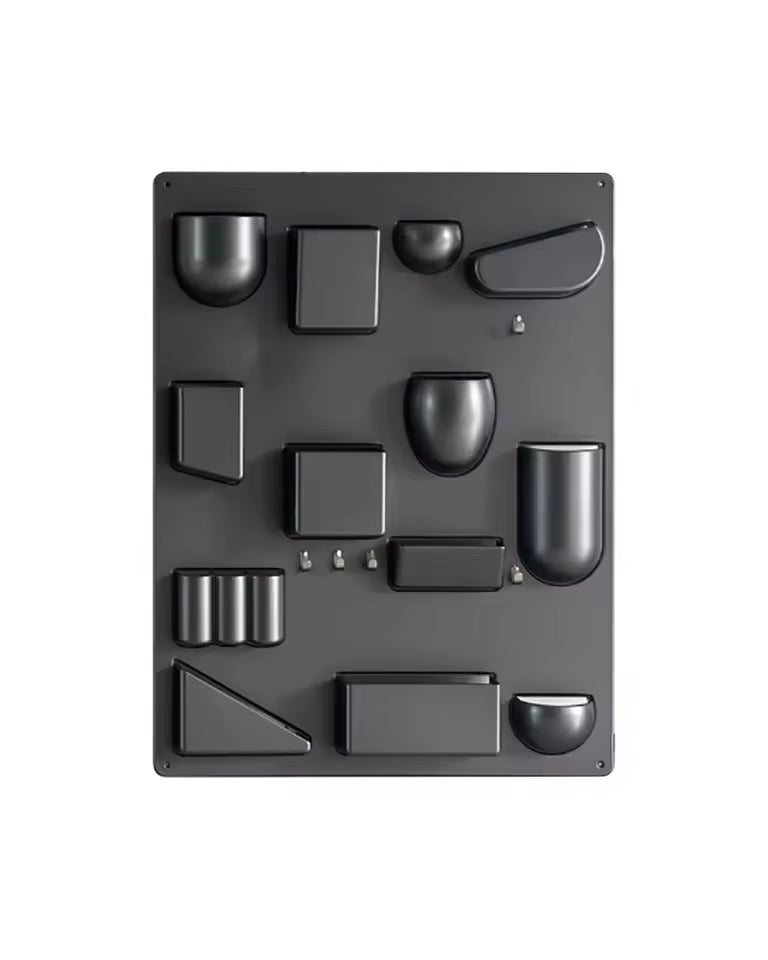 Black silicone mold with various shaped cavities on a white background