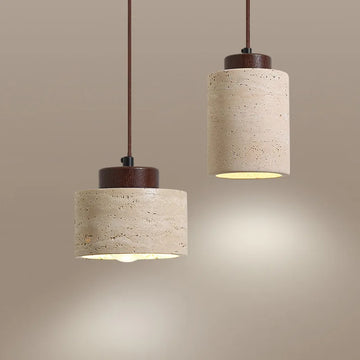 Nordic cylinder pendant light with textured beige shade and warm ambient lighting for dining area.