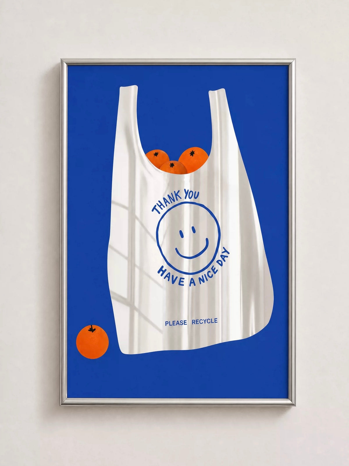 The Orange Bag wall mirror shows a white bag with a smiley face and orange fruit against a vivid blue panel.