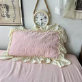 Dreamy coquette bedroom with pink bedding and lace detailing