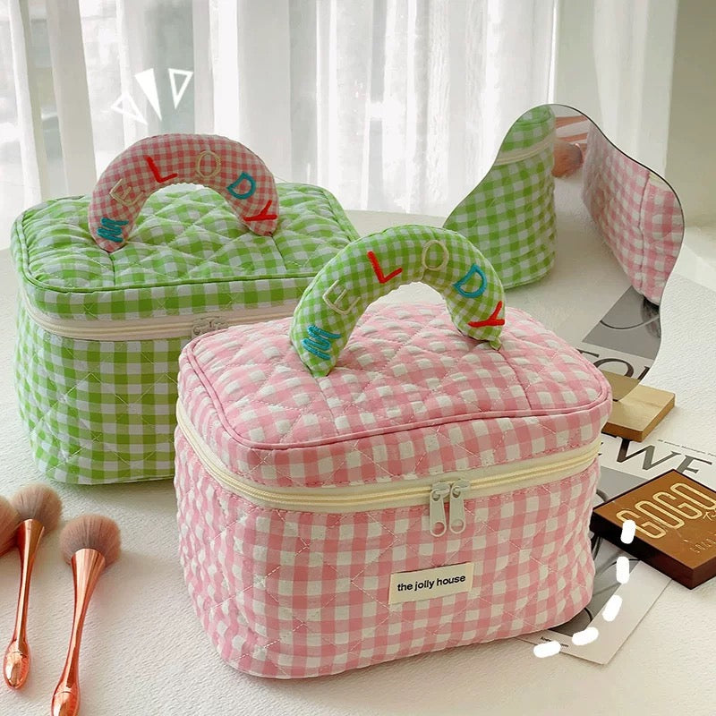 Large capacity travel toiletry bag in soft pastel plaid design for ladies