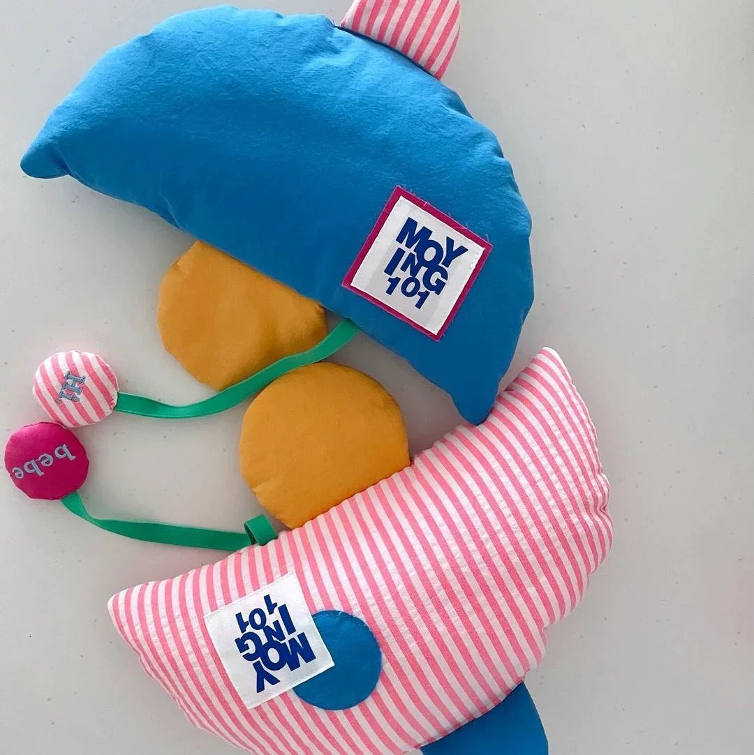 Toy hammer with colorful head and striped handle on a white background