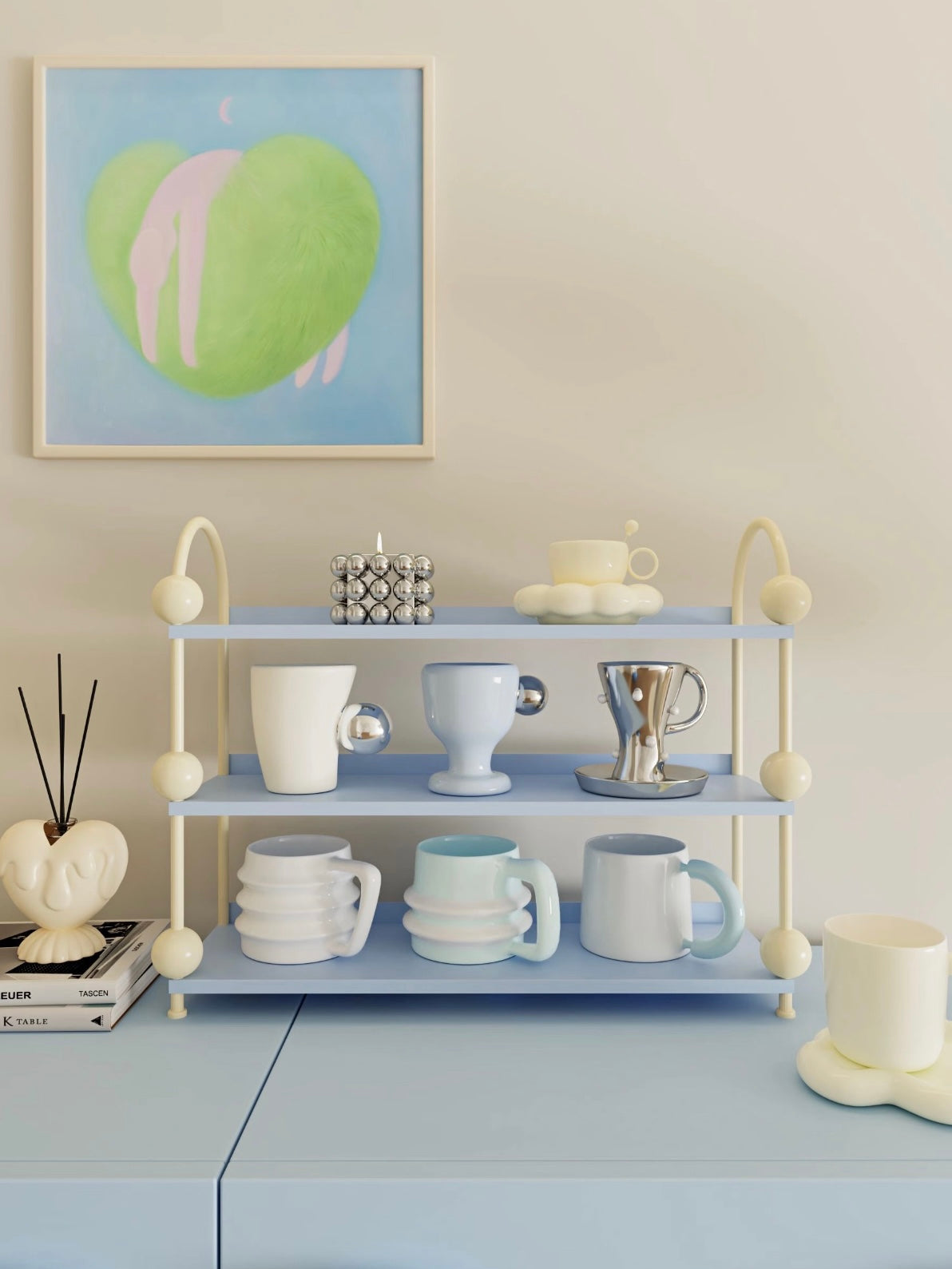 Blue perfume display shelf with cream arches and ball details holds cups and saucers across open tiers.