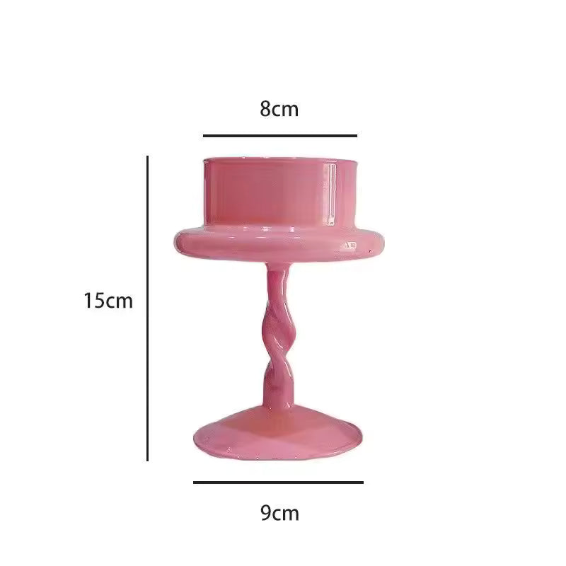 Pink candle holder with dimensions labeled on a white background
