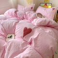 Pink heart embroidered duvet cover displayed in a soft girl bedroom setup