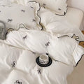 Pink duvet cover set with delicate bow details and soft ruffles